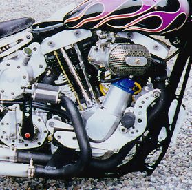Monster, magneto-ignited masher is the powerplant. Stroker shovelhead engine displaces 89 cubic inches, contained in ultra-strong STD cases.