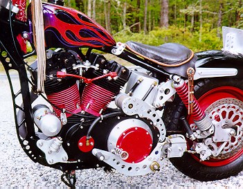 Stylish solo leather seat atop high-tech softail suspension.